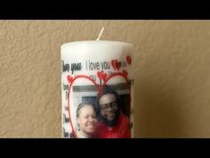 a candle that has a photo on it with the words i love you and two hearts