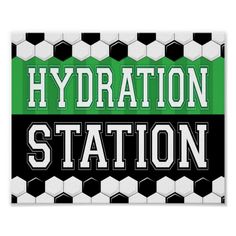 a green and black sign that says hydration station with soccer balls in the background