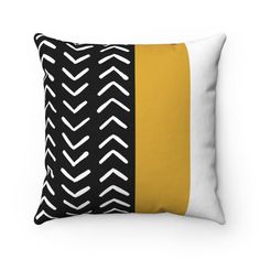 a black and yellow pillow with white lines on the front, in two different colors