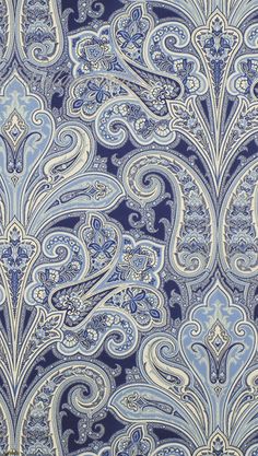 a blue and white paisley print wallpaper with an intricate design on the back side