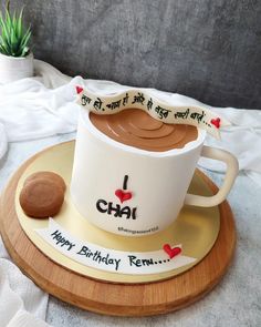 a cake shaped like a coffee cup on top of a plate