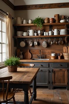 a kitchen with wooden floors and shelves filled with pots and pans