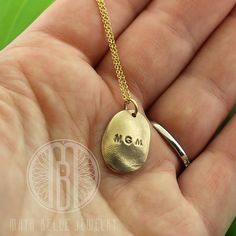 "One child's fingerprint in solid silver or solid bronze. The silver is paired with a sterling silver adjustable chain and the bronze with a 14k gf adjustable chain. This listing is for one child's fingerprint that is taken from a mold and fired as a solid, bronze or solid silver charm to cherish forever. If you would like an adult print or a child's thumb print rather than a child's finger print, send me a message and I'd be happy to create a custom listing for you, as they require more metal. Adjustable Sterling Silver Jewelry Stamped 14k, Minimalist 14k Gold Keepsake Jewelry, Hand Stamped Sterling Silver Necklaces In Yellow Gold, Adjustable Round Pendant Jewelry With Engraving Option, Minimalist Oval Pendant Keepsake Jewelry, Minimalist Hand Stamped Keepsake Jewelry, Minimalist Hand Stamped Jewelry For Anniversary, Minimalist Stamped Pendant Jewelry, Engraved Oval Pendant Jewelry For Everyday