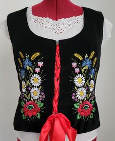 Embroidered folk vest made of black velvet, fitted with darts, lined, decorated with computer embroidery, used for folk costumes. Dimensions: size 44 - vest length 57 cm, chest circumference - 102 cm, waist circumference 88 cm. Dimensions: size 42 - vest length 57 cm, chest circumference - 96 cm, waist circumference 82 cm. Dimensions: size 40 - vest length 57 cm, chest circumference - 92 cm, waist circumference 78 cm. Dimensions: size 38 - vest length 57 cm, chest circumference - 88 cm, waist ci Embroidered Vest, Pretty Embroidery, Velvet Vest, Computer Embroidery, Folk Costume, Vest Outfits, Beautiful Embroidery, Womens Vest, To My Daughter