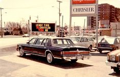 an old photo of cars parked in front of a sign that says chaser on it