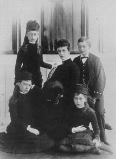 an old black and white photo of children posing for a group shot in the early 1900's