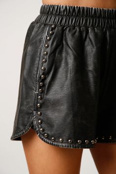 Studded Acid Wash Faux Leather Shorts- Elastic waistband- Dolphin hem- Studded front detail55% Rayon 45% Polyester Black Bottoms With Waistband For Spring, Edgy Fall Shorts With Belt Loops, Faux Leather Bottoms With Belt Loops, Short Length, Faux Leather Shorts With Belt Loops, Spring Leather Short Bottoms, Chic Black Bottoms With Wide Waistband, Casual Leather Bottoms With Belt Loops, Casual High Waist Leather Bottoms, Chic Leather Bottoms With Elastic Waistband