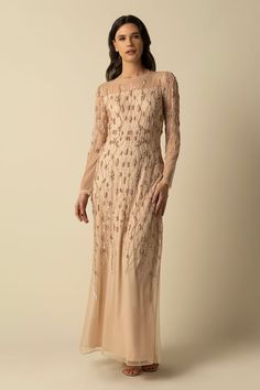 Beige gown embroidered with beads and sequin in wavy pattern. - Aza Fashions Floor-length Sequin Gown For Mother Of The Bride, Luxury Sequined Mother Of The Bride Evening Dress, Mother Of The Bride Sequined Gown With Fitted Bodice, Embellished Sequin Long Dress For Wedding, Long Embellished Sequin Dress For Wedding, Elegant Hand Embellished Floor-length Sequin Dress, Elegant Floor-length Hand Embellished Sequin Dress, Mother Of The Bride Gown With Intricate Embroidery, Sequined Long Sleeve Gown For Mother Of The Bride