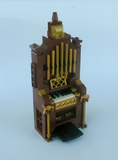 an organ made out of legos on a white surface