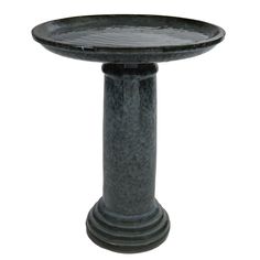 a bird bath sitting on top of a pedestal