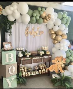 a baby shower is set up with balloons and desserts for the baby's first birthday