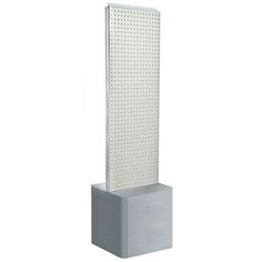 a tall white sculpture with perfored panels on the sides and dots on the top