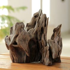 a close up of a wooden object on a table