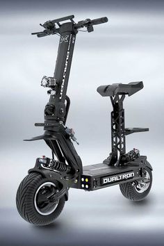 an electric scooter with two wheels on the front and one wheel in the back