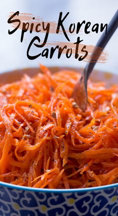 a bowl full of carrots with the words spicy korean carrots above it in black lettering