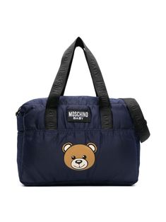 navy blue signature Teddy Bear motif embroidered logo to the front two flat top handles top zip fastening adjustable logo-jacquard shoulder strap two side pouch pockets main compartment multiple internal slip pockets full lining changing mat Navy Nylon Bag With Pockets, Travel Shoulder Bag With Embroidered Logo, Blue Travel Bag With Logo, Blue Travel Bags With Logo, Blue Logo Travel Bags, Nylon Bag With Embroidered Logo For Everyday Use, Everyday Nylon Bags With Embroidered Logo, Blue Shoulder Bag With Embroidered Logo For Travel, Blue Shoulder Bag With Logo And Double Handles