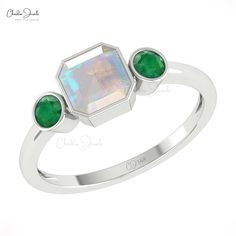 Description Celebrate special moments with our ethiopian opal and emerald gemstone ring. Featuring three stones in a row, one 6mm octagon-cut opal and two round-cut emerald in 14k gold band. A thoughtful and timeless gift for any special woman of your life. Product Details SKU CJ R 1782 OP Product dimension - Metal 14K Solid Gold Birthstone October ETHIOPIAN OPAL DETAILS Size 6mm Quality AAA Pieces 1 Weight 1.75 carats Stone setting Bezel Enhancement None EMERALD DETAILS Size 3mm Quality AAA Pie Dual Birthstone Ring, 3 Stone Rings, Bezel Set Ring, Fire Opal Ring, Emerald Stone, Emerald Gemstone, 14k Gold Ring, Minimalist Rings, Dainty Ring