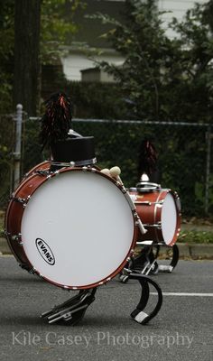 a drum player is performing on the street