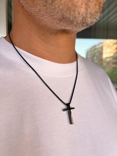 Men's Cross Pendant Necklace is a durable silver-colored box chain made of hypoallergenic stainless steel. A great choice as a gift for him. Dimensions: Cross - height 30 mm, width 18 mm, thickness 4.8 mm; Chain - thickness 2 mm, length of your choice. To choose the length of the necklace: 1. Prepare a thread and a ruler. 2. Take a thread of the desired necklace length. 3. Try it on in front of a mirror to see how it will look on your neck. 4. Unwind the thread and measure its length with a ruler. Following these steps, you can accurately determine a comfortable and stylish necklace length. Features: - Material: hypoallergenic stainless steel. - Design: classic rope chain. - Durability: Resistant to tarnishing, corrosion, and daily wear. - Comfort: Suitable for sensitive skin due to hypoal Durable Black Stainless Steel Jewelry, Minimalist Matte Black Jewelry For Gifts, Minimalist Matte Black Jewelry Gift, Modern Matte Black Jewelry For Gifts, Modern Matte Black Jewelry As Gift, Modern Matte Black Jewelry As A Gift, Minimalist Black Cross Pendant Jewelry, Durable Stainless Steel Necklaces For Gifts, Durable Stainless Steel Necklace For Gifts