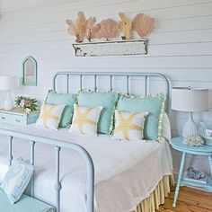 a bedroom with white walls and blue furniture