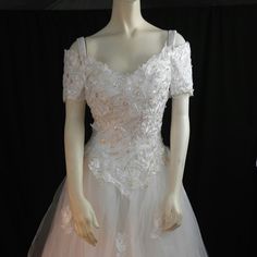 Has Embroidery On Top With Flowers And Pearls In Center, Skirting On The Dress Is A Very Soft Tulle With Lace Flowers Sewn On, Very Beautiful Dress And Nice Train. Elegant Floral Embroidery Ball Gown For Debutante Ball, Fitted Floral Embroidered Ball Gown For Wedding, Embroidered Gown With Fitted Bodice For Debutante Ball, Floor-length Gown With Intricate Embroidery For Wedding Reception, Floor-length Embroidered Gown For Wedding Reception, Intricate Embroidery Floor-length Gown For Wedding Reception, Fitted Wedding Ball Gown With Pearl Embroidery, Embroidered Wedding Dress With Sweetheart Neckline, Embroidered Sweetheart Neckline Wedding Dress