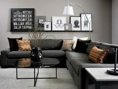 a living room filled with lots of furniture and pictures on the wall above it's coffee table