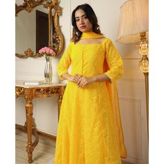 Yellow colored anarkali suit is prettified with chikankari work as shown which makes it appear classy. This top is made of georgette fabric which is accompanied with crepe bottom, inner and georgette dupatta. Women can buy this suit to wear for their parties and functions. Note:- The actual product may differ slightly in color and design from the one illustrated in the images when compared with computer or mobile screen. Size Chart Size: Semi Stitched/Unstitched can be altered from maximum to mi Semi-stitched Salwar Kameez With Lace Work, Lace Anarkali Salwar Kameez For Party, Anarkali Kurta With Lace Work For Party, Party Anarkali Kurta With Lace Work, Fitted Lace Anarkali Set, Georgette Sharara With Lace Work, Anarkali Georgette Dupatta With Lace Work, Yellow Elegant Georgette Churidar, Elegant Yellow Georgette Unstitched Suit