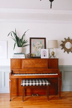 a piano sitting in the corner of a room