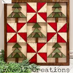 an image of a christmas tree quilt pattern on the front of a wooden box frame