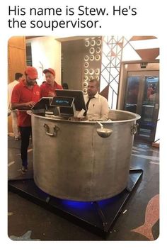 two men standing in front of a large metal tub with laptops on it and the caption reads, his name is stew he's the souper