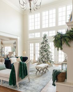 a living room filled with furniture and christmas trees