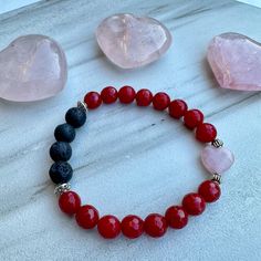 This adorable bracelet features faceted Red Jade gemstones, a Rose Quartz heart, lava stones, and Tibetan silver accent beads. Made with high quality elastic cord. Beads are 8mm which is slightly larger than the size of a pea. *To use as a diffuser bracelet, apply a drop or two of 100% pure essential oil to the lava stones. The scent will last for 1-2 days. Red Jade Healing Properties: Good Luck, Peace, Tranquility Rose Quartz Healing Properties: Love, Compassion & Acceptance Lava rock is known Spiritual Beaded Bracelets For Valentine's Day, Heart-shaped Bracelets With Faceted Beads For Gifts, Heart Shaped Bracelets With Faceted Beads For Gifts, Heart-shaped Bracelet With Faceted Beads For Gifts, Heart-shaped Faceted Beads Bracelet Gift, Spiritual Heart-shaped Beaded Bracelets For Valentine's Day, Valentine's Day Adjustable Beaded Bracelets With Faceted Beads, Valentine's Day Adjustable Bracelets With Faceted Beads, Valentine's Day Gift Beaded Bracelet With Faceted Beads