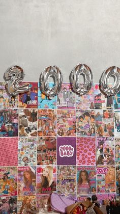 the wall is covered with pictures and balloons