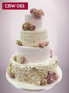 a three tiered wedding cake with flowers on the top and bottom layer is shown