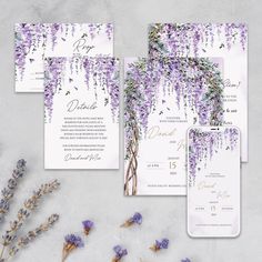 wedding stationery with purple flowers and greenery