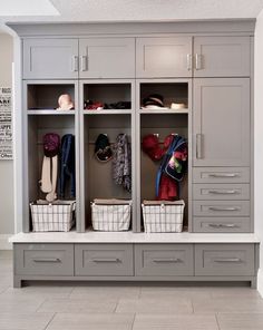 a large walk in closet filled with lots of drawers and baskets on top of it