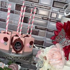 there is a cake with pink candles on it