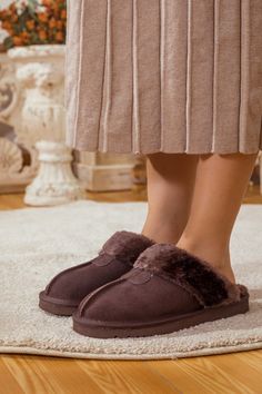 Deliver convenient slip-on comfort to their weekend mornings with these soft suede slippers designed with a cozy wool lining and durable rubber sole for indoor/outdoor use. Pairs perfectly with our chesterfield knit sweater or snug fleece lounge sets. 0.78'' heel Slip-on 100% leather upper 100% Wool lining Rubber sole Feature: Lightweight, ultra-soft fully woolen lined, anti-skid rubber sole. Cozy Brown Slippers Super Soft, Super Soft Brown Indoor Slippers, Brown Suede Indoor Slippers, Super Soft Comfortable Brown Slippers, Sheepskin Slip-on Slippers With Cushioned Footbed, Cozy Indoor Suede Slippers, Winter Brown Suede Slippers, Indoor Suede Slip-on Slippers, Suede Slip-on Indoor Slippers