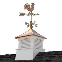 a weather vane on top of a roof with a rooster figurine atop it