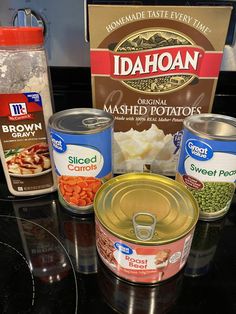 the ingredients to make baked potato soup are displayed on a counter top, including canned beans and mashed potatoes