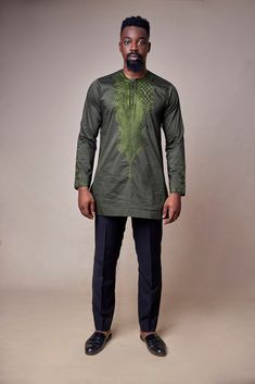 Classic African men traditional wear. Made from premium poly-cotton blend, this easy-wearing long sleeve slip on shirt offers a relaxed fit through the body for an effortlessly stylish look. 'Oloye ' shirt will pair well the neutral slacks or Jeans you already own. PRODUCT DETAILS - Intricate neck embroidery  - Key hole  - Hidden button fastener -Composition: poly-cotton - Embroidery on neck and sleeve cuffs - Side vents SIZE & FIT -Model is wearing medium size Love handmade African clothings and accessories?   Check our shop: https://www.zanaani.com/ Follow us on instagram : @ Zan_aani Add our shop to your favourites to get immediate updates on our new listings. Traditional Fitted Agbada With Long Sleeves, Fitted Cotton Long Sleeve Kaftan, Fitted Long Sleeve Agbada For Eid, Fitted Long Sleeve Kaftan For Eid, Fitted Long Sleeve Agbada For Festive Occasions, Long Sleeve Embroidered Agbada For Festivals, Long Sleeve Embroidered Agbada For Festive Occasions, Traditional Long Sleeve Shirt For Eid, Embroidered Long Sleeve Agbada For Eid