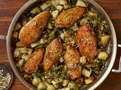 some chicken and vegetables in a pan on a table