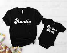 Auntie And Auntie's Bestie Matching T-shirt, New Aunt Shirt, Aunt And Niece Tee, Aunt Nephew T-shirt, Baby Shower Aunt Shirt, Aunt To Be Tee Each item is sold separately! Welcome to GUERILLA GRAPHICS,  Where creativity meets style in the form of printed apparel! Step into our world of edgy designs and bold statements with our curated collection of t-shirts, sweatshirts, and hoodies. Each garment is a canvas for self-expression, featuring eye-catching graphics that make a statement and stand out from the crowd. From urban-inspired prints to thought-provoking imagery, GUERILLA GRAPHICS offers apparel that speaks volumes without saying a word. Whether you're looking to make a statement or simply add a touch of rebellious flair to your wardrobe, our collection has something for every style mav Aunt Nephew, New Aunt, Bold Statements, Sweatshirts And Hoodies, Thought Provoking