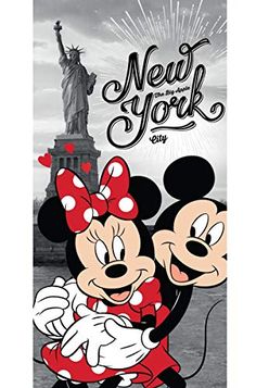 mickey and minnie mouse hugging in front of the statue of liberty