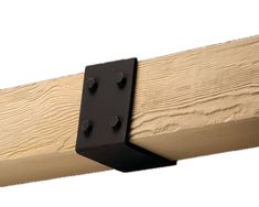 a close up of a wooden beam with black brackets