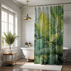 a bathroom with a bathtub, sink and shower curtain that has green leaves on it