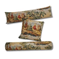 three decorative pillows with paintings on them