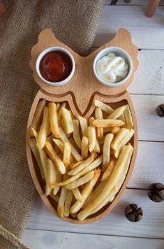 an owl shaped tray with french fries and ketchup