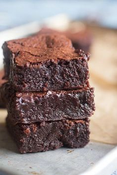 chocolate brownies stacked on top of each other