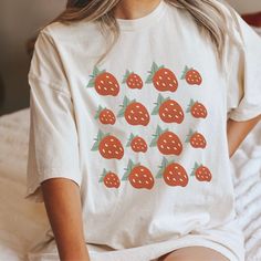 This strawberry tshirt makes a totally unique strawberry gift for strawberry pickers, gardeners, and just any strawberry lover in your life! This strawberry crewneck is the perfect cottage core aesthetic fruit shirt for spring, summer, and more! Grab this tee today while it's on sale! Delivery Times: ◦ Production: 1 business day on average (maximum: 5) ◦ Shipping: 2 business days on average (maximum: 5) Unisex Fit: ◦ Extra soft, preshrunk unisex t-shirt ◦ Women: Semi-fitted, laidback, rollable, & tuckable ◦ Men: Fitted on upper body & loose around the belly ☞ Size up for a looser fit Soft Materials: ◦ Super soft, preshrunk tee with eco-friendly materials ◦ Black, White, & Navy: 100% soft ring spun cotton ◦ Heather Navy: 65% polyester & 35% cotton ◦ Sport Grey: 90% cotton & 10% polyester Strawberry Tshirt, Strawberry Clothing, Aesthetic Fruit, Funny Science Shirts, Strawberry Aesthetic, Lesbian Shirts, Lesbian Gifts, Strawberry Gifts, Fruit Shirt